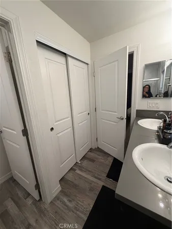 a bathroom with a sink a mirror and shower