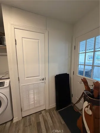 a view of a workspace with furniture and closet