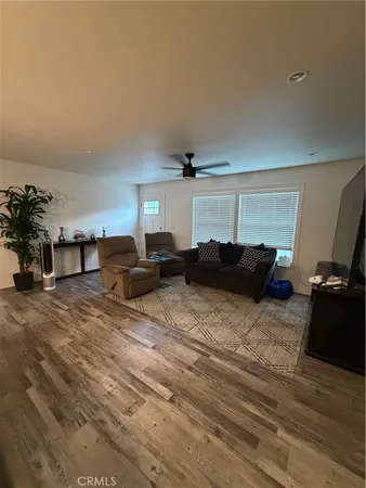 a bed room with furniture and a flat screen tv