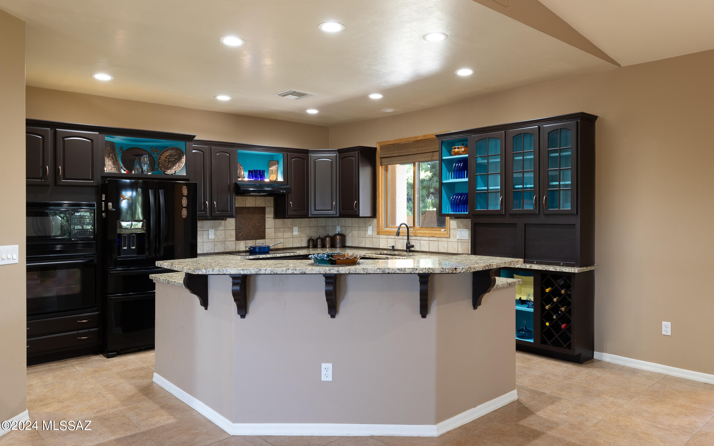 341 Sharon Road Vail, AZ 85641 - Photo 6 of 50 a view of kitchen with stainless steel appliances granite countertop a sink and a counter top space