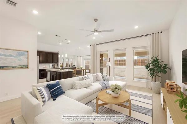 a living room with furniture kitchen and a chandelier