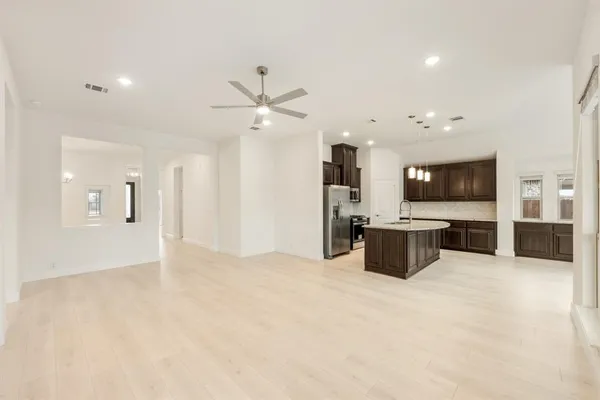 a view of an empty room with a flat screen tv