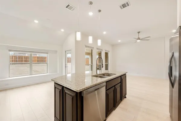 a bathroom with a sink a vanity and a large mirror