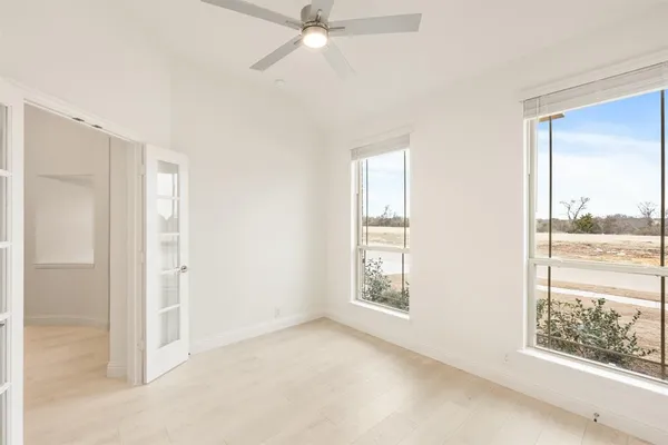 a view of an empty room with a window
