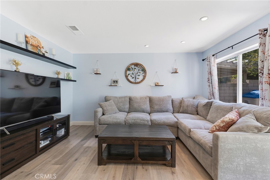 3843 San Gabriel Street Simi Valley, CA 93063 - Photo 25 of 52 a living room with furniture a flat screen tv and a window