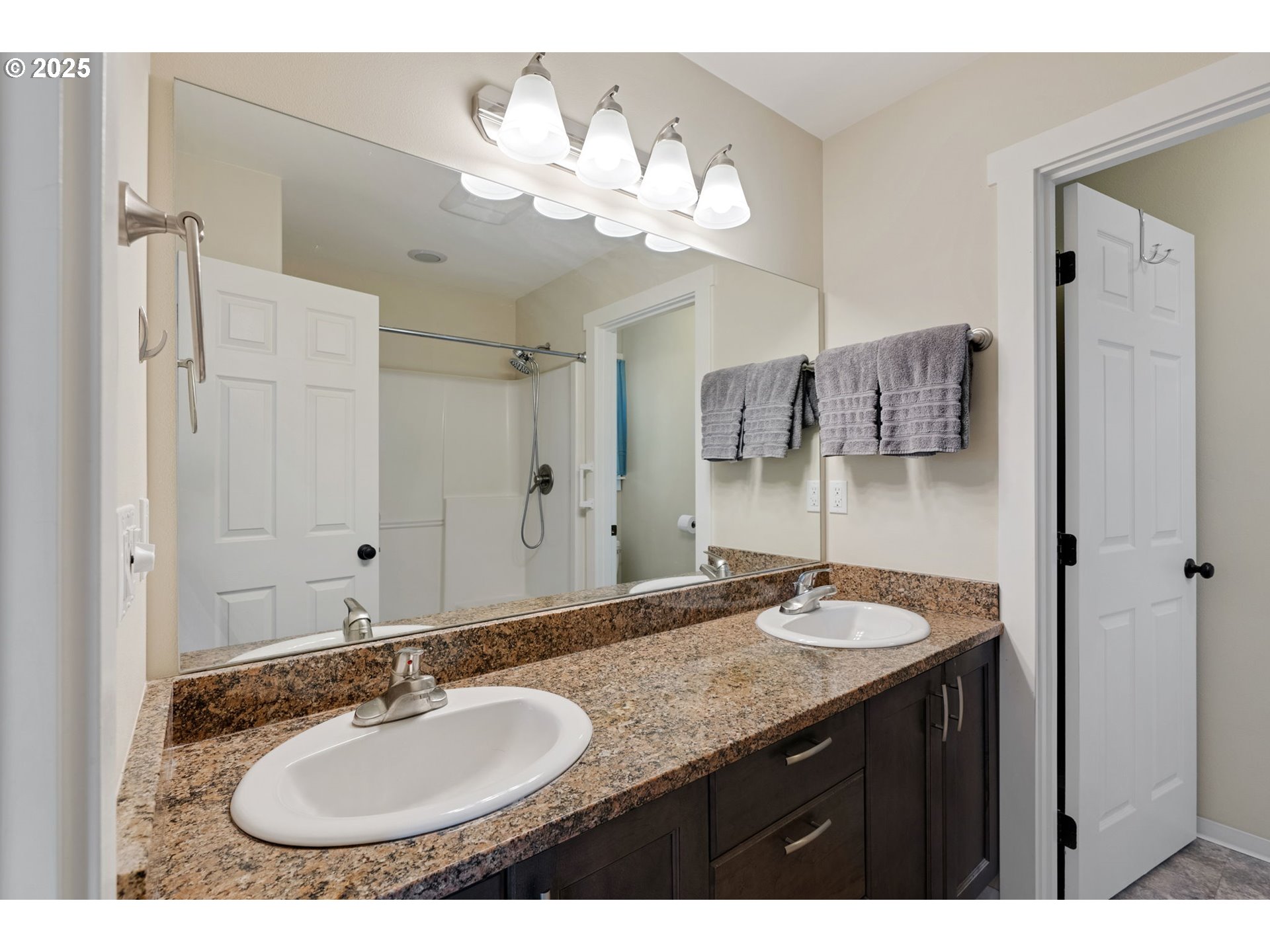 3529 Jones Loop Hood River, OR 97031 - Photo 15 of 39 a bathroom with a granite countertop sink and a mirror