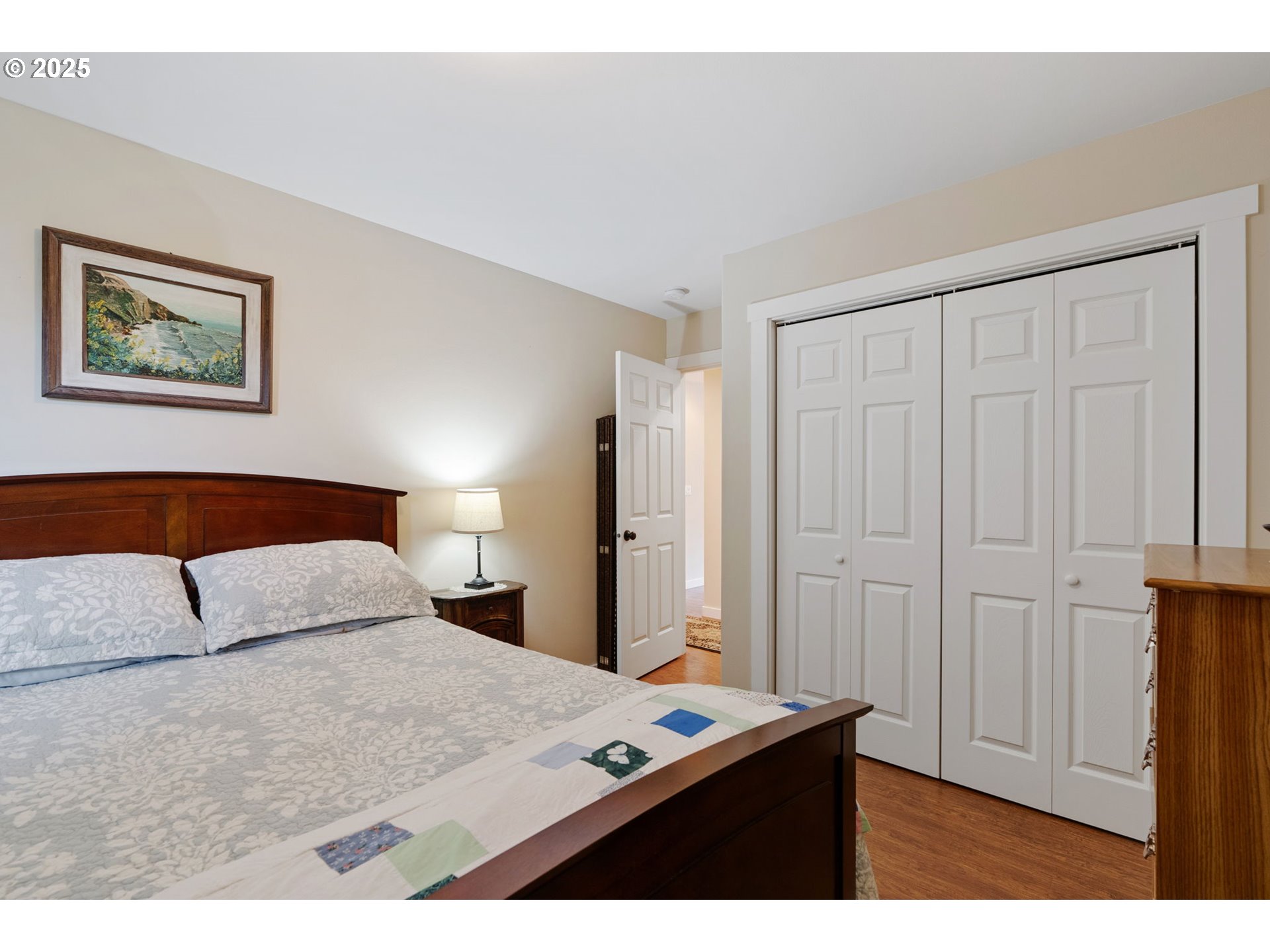 3529 Jones Loop Hood River, OR 97031 - Photo 21 of 39 a bedroom with a bed and a lamp