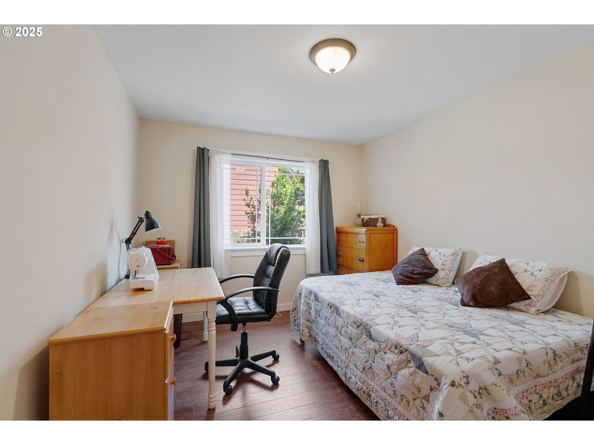 3529 Jones Loop Hood River, OR 97031 - Photo 24 of 39 a bedroom with a bed and wooden floor