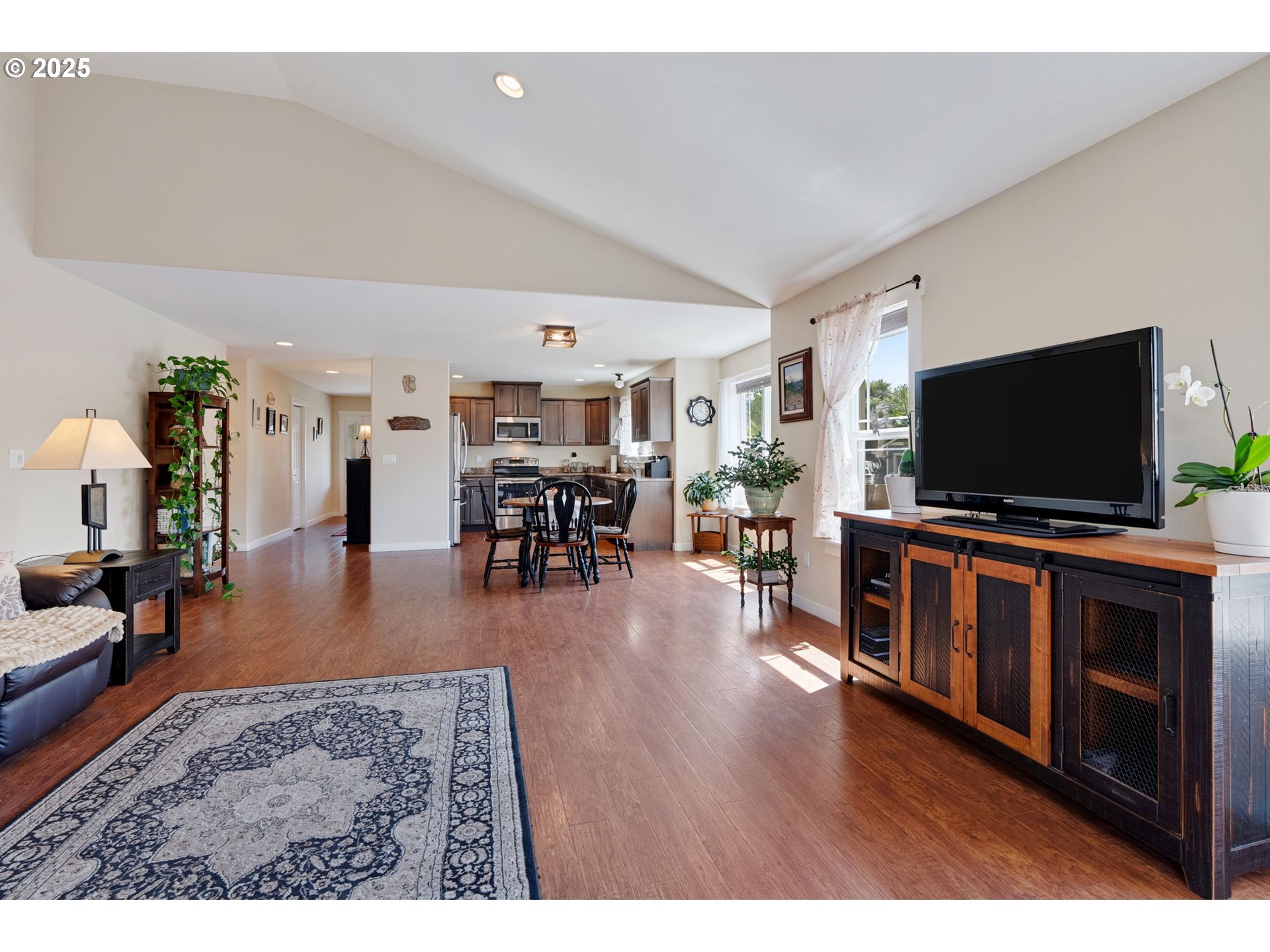 3529 Jones Loop Hood River, OR 97031 - Photo 8 of 39 a living room with furniture and a flat screen tv