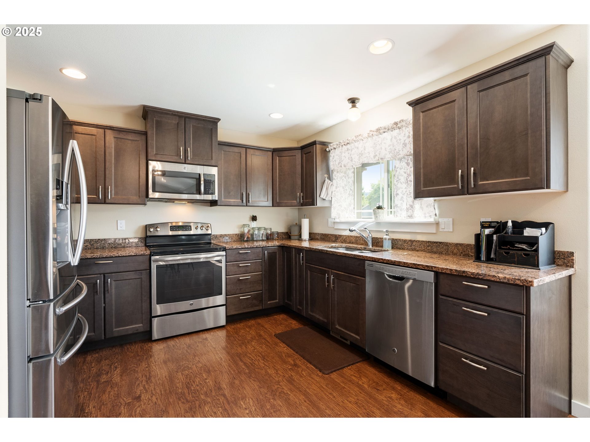 3529 Jones Loop Hood River, OR 97031 - Photo 10 of 39 a kitchen with kitchen island granite countertop stainless steel appliances and wooden cabinets