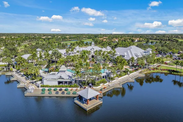 an aerial view of residential houses with outdoor space and seating