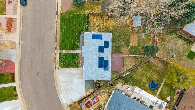 an aerial view of residential houses with outdoor space