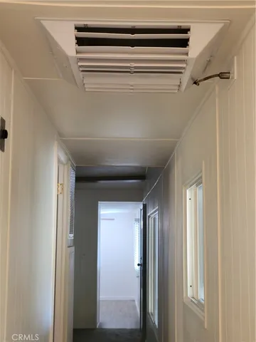 an empty room with closet area