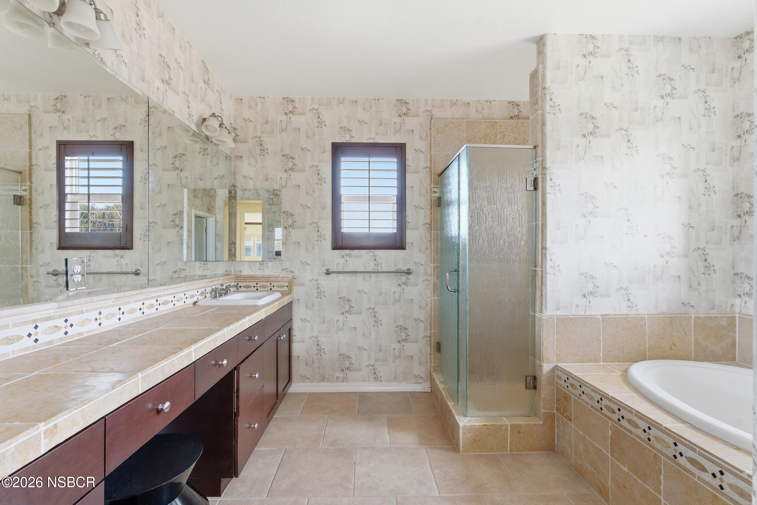5632 Menemsha Lane Santa Maria, CA 93455 - Photo 31 of 66 a view of bathroom with a tub sink shower and mirror
