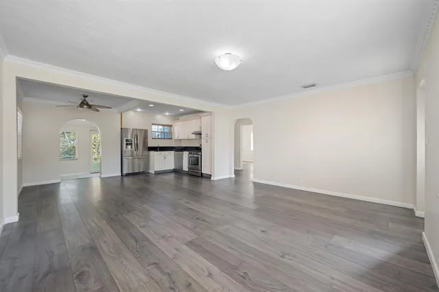 a bathroom with a toilet sink and vanity