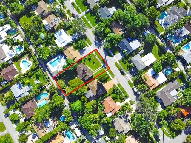 an aerial view of a house with a garden