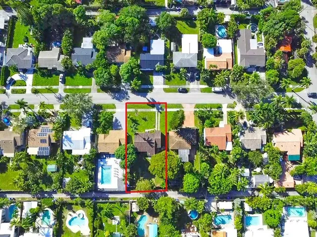 an aerial view of a house with a garden