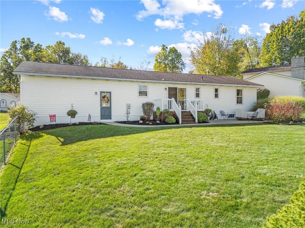 1521 Bravado Road Southwest Canton, OH 44706 - Photo 23 of 37 Back of property with a lawn and a patio