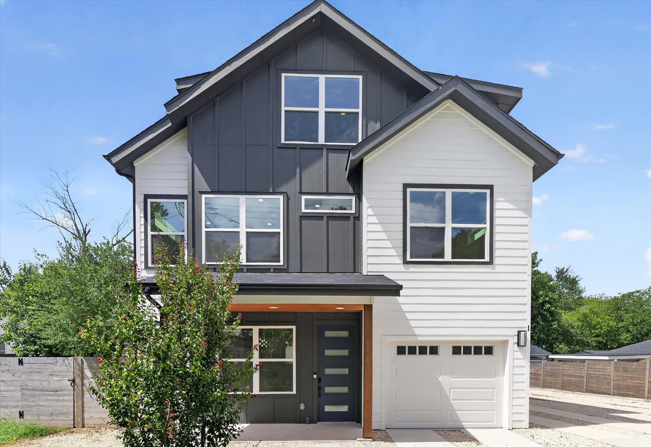 5305 Ledesma Road, Unit 1 Austin, TX 78721 - Photo 3 of 37 Bold modern exterior design showcases striking contrast panel siding and clean architectural lines.