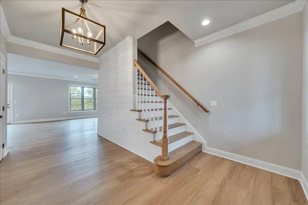 a view of an entryway with wooden floor