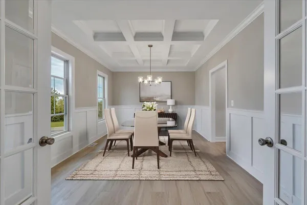 a view of a dining room with furniture window and wooden floor