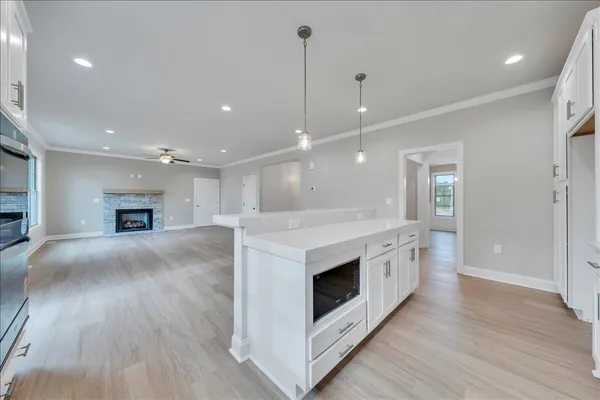 a view of kitchen with sink and microwave
