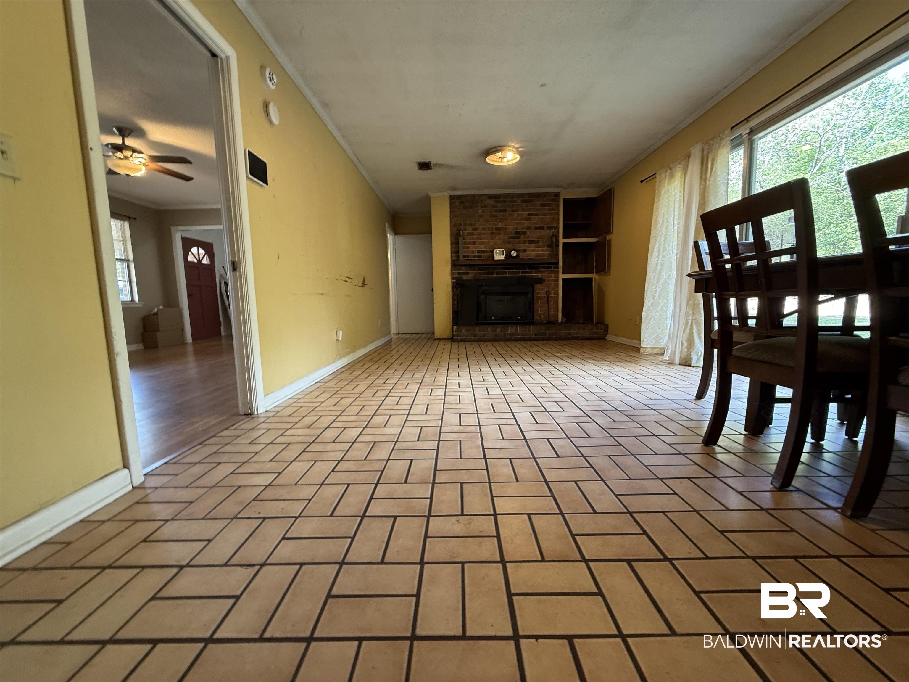 2807 Pea Ridge Road Brewton, AL 36426 - Photo 5 of 12 Rectangular tile flooring in a geometric pattern throughout the main living area