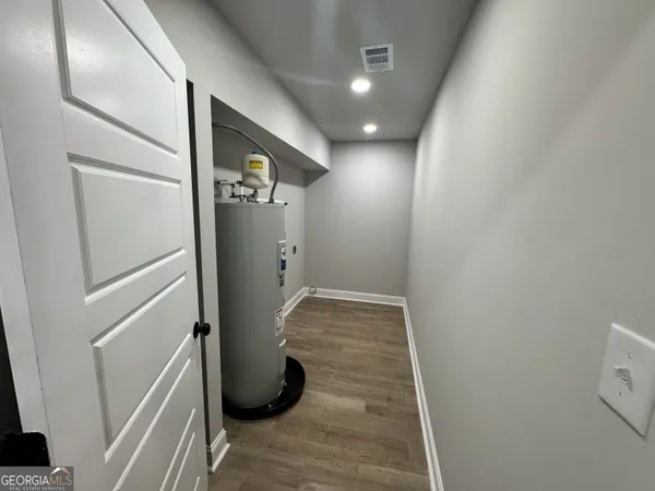 a view of a storage & utility room with two washing machine