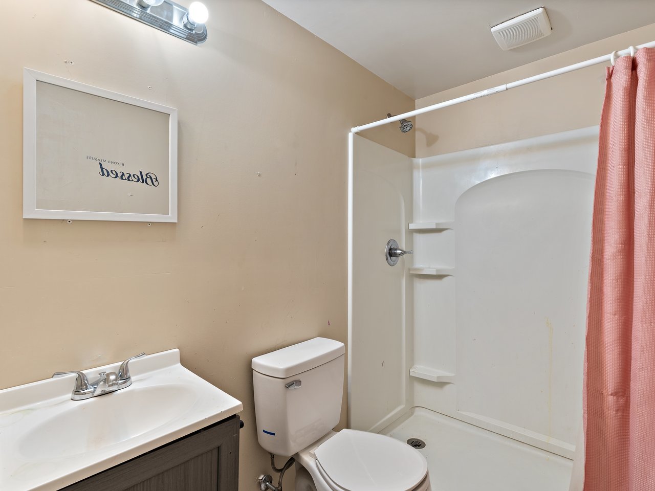 1546 12th Avenue Moline, IL 61265 - Photo 32 of 32 a white toilet sitting next to a bathroom sink