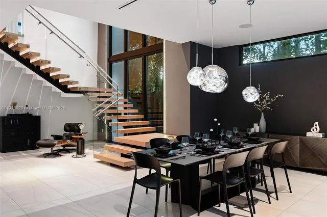 a front view of a house with entryway and wooden floor