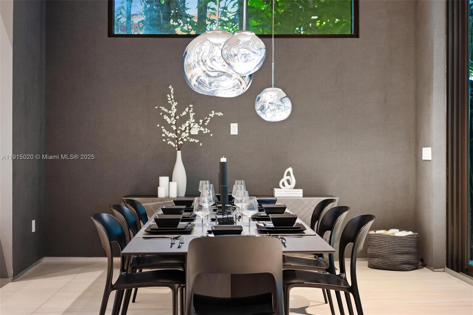 77 Southwest 18th Terrace Miami, FL 33129 - Photo 16 of 90 a dining room with a wooden table and chairs