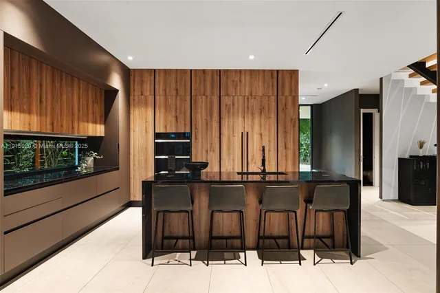 a balcony view with a couch and large trees