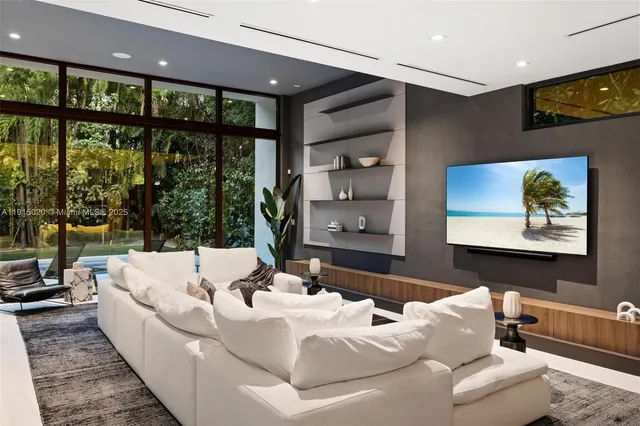 a bathroom with a sink a toilet a mirror and shower