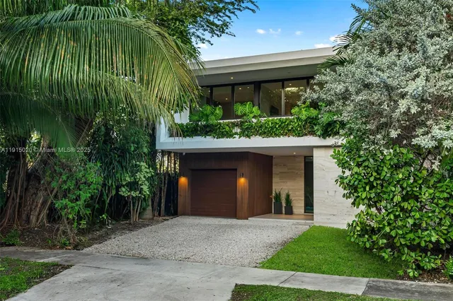 a living room with furniture a wooden floor and next to a window