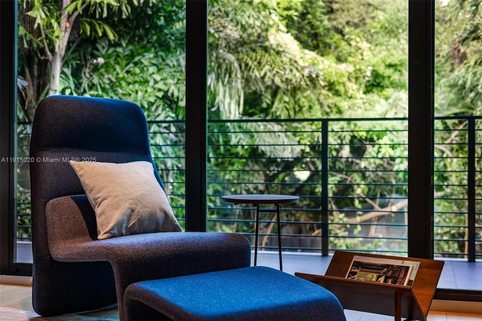 77 Southwest 18th Terrace Miami, FL 33129 - Photo 37 of 90 a balcony view with a couch and large trees