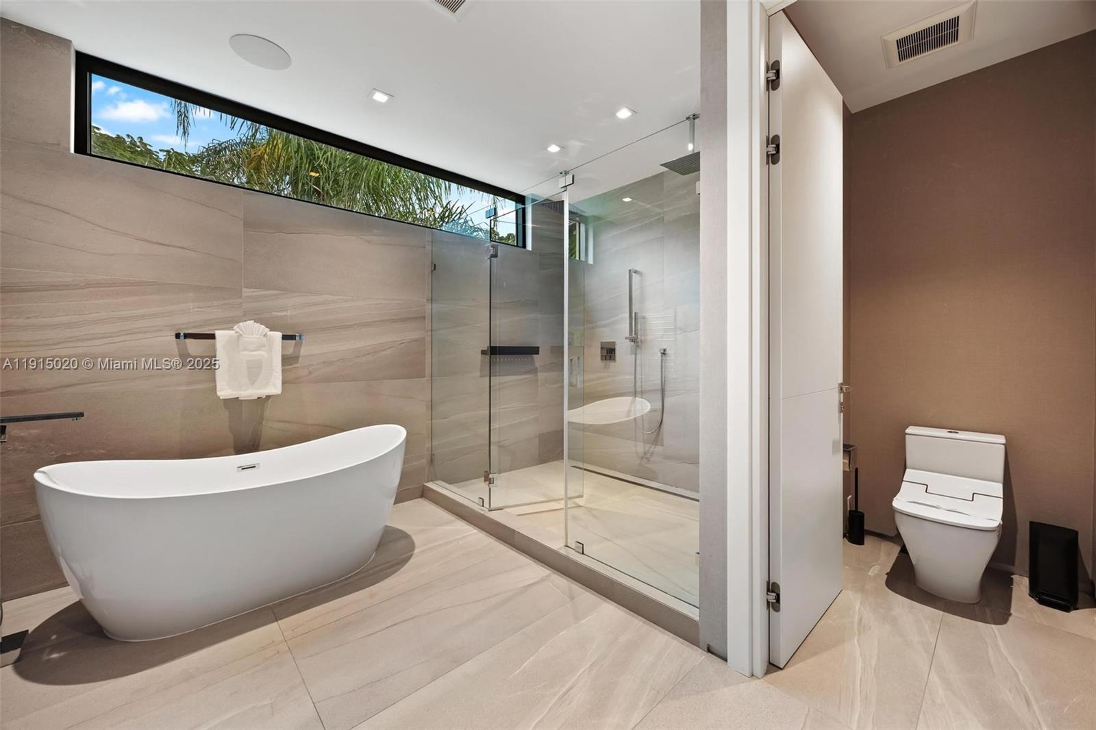 77 Southwest 18th Terrace Miami, FL 33129 - Photo 40 of 90 a bathroom with a bathtub and toilet