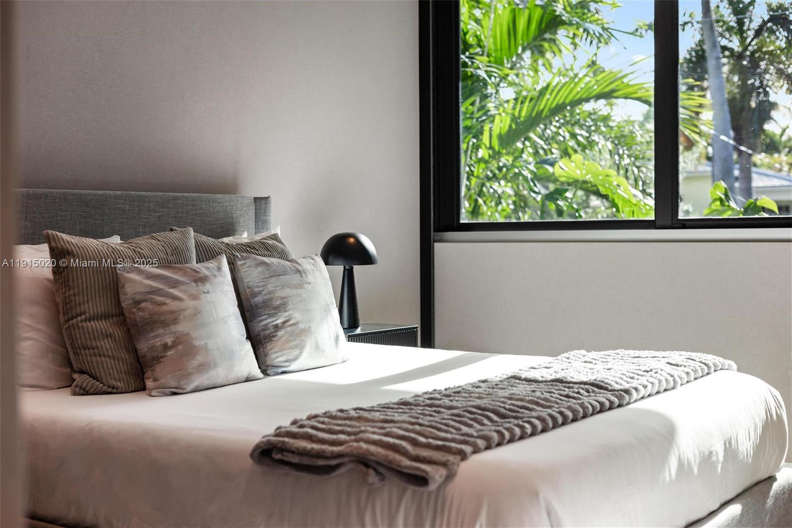 77 Southwest 18th Terrace Miami, FL 33129 - Photo 44 of 90 a bedroom with a bed and a window