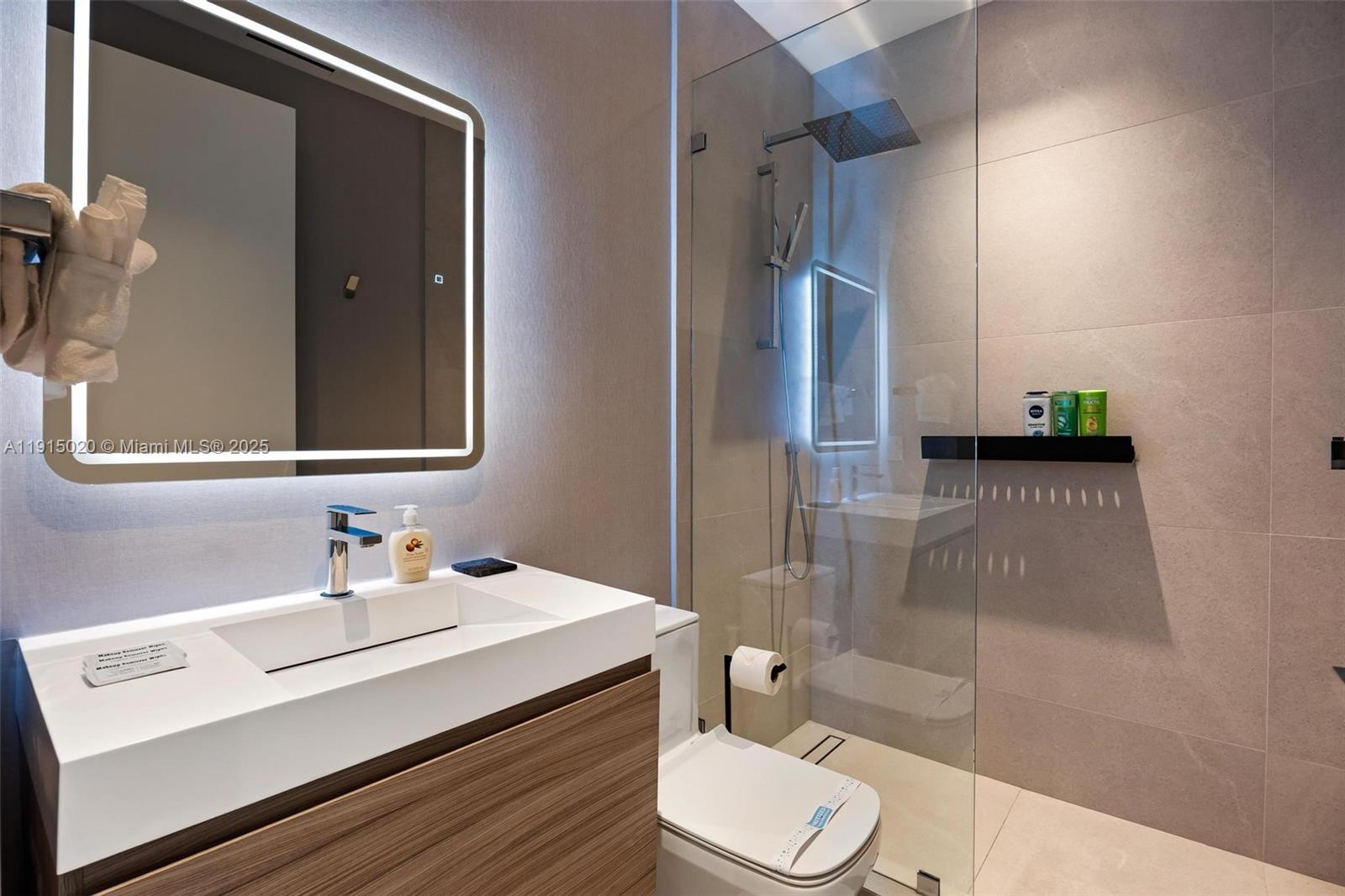 77 Southwest 18th Terrace Miami, FL 33129 - Photo 47 of 90 a bathroom with a sink a toilet and shower