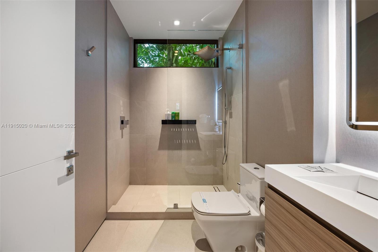 77 Southwest 18th Terrace Miami, FL 33129 - Photo 50 of 90 a bathroom with a sink a toilet and shower