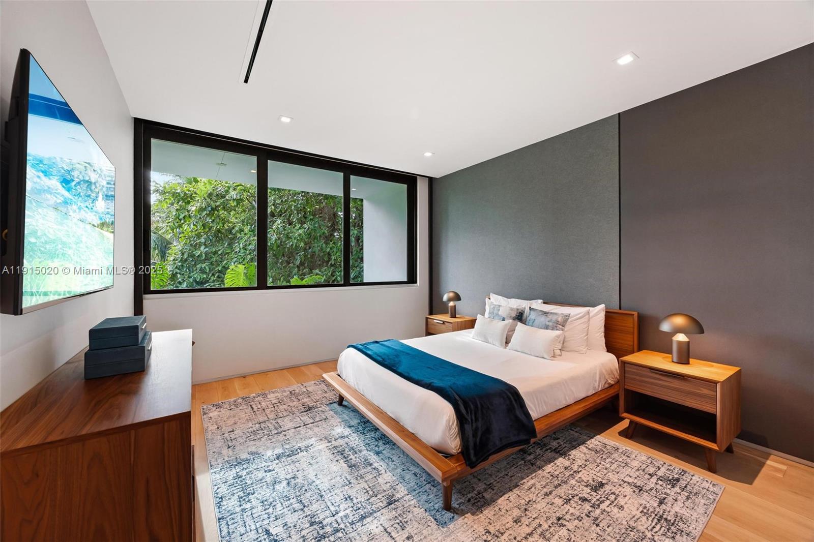 77 Southwest 18th Terrace Miami, FL 33129 - Photo 53 of 90 a bedroom with a bed and a large window