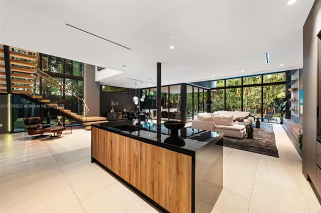 a dining room with a wooden table and chairs