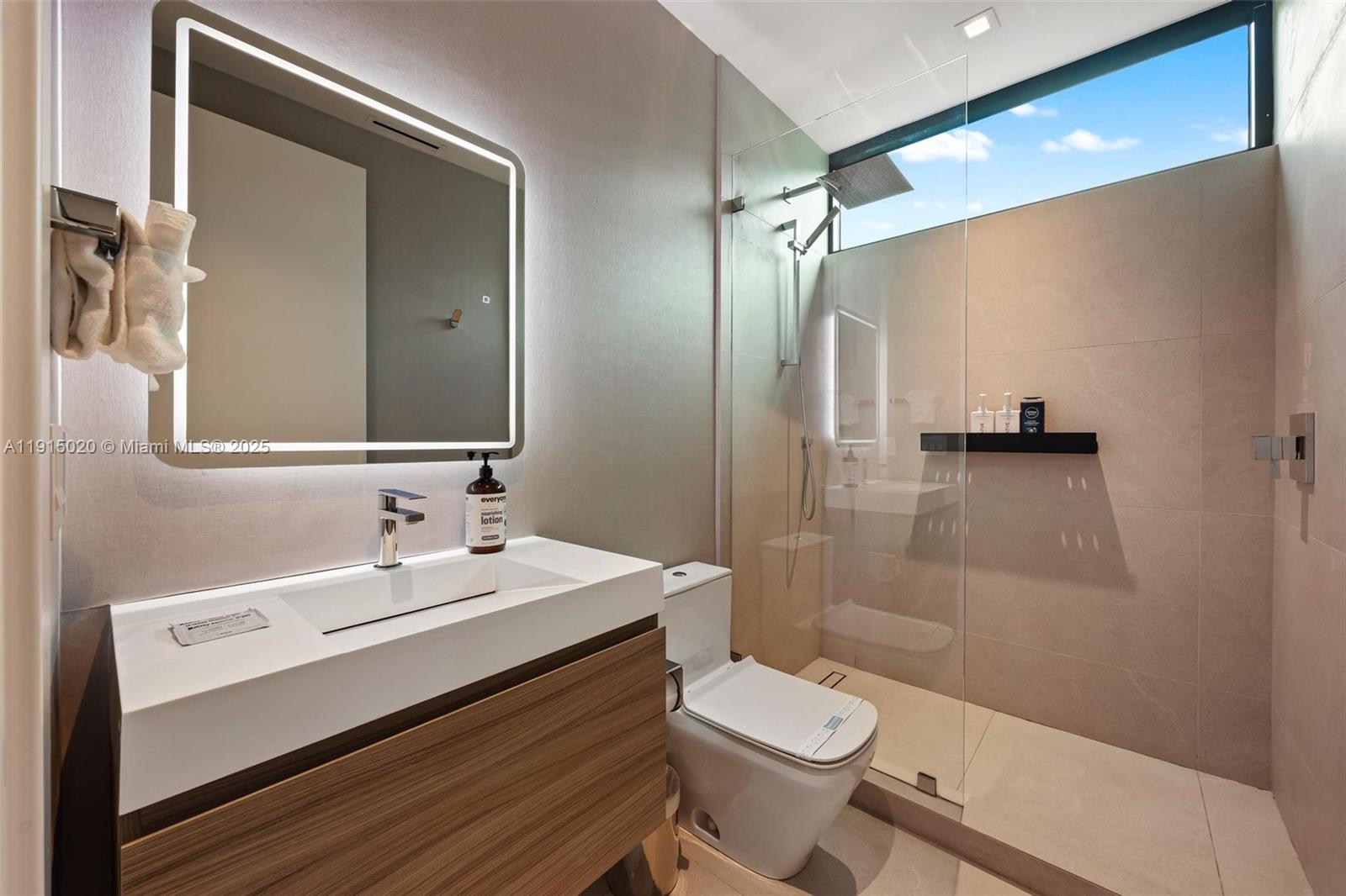 77 Southwest 18th Terrace Miami, FL 33129 - Photo 62 of 90 a bathroom with a sink a toilet and shower