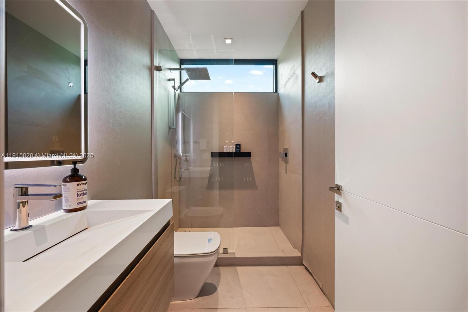 77 Southwest 18th Terrace Miami, FL 33129 - Photo 63 of 90 a bathroom with a sink a toilet and shower