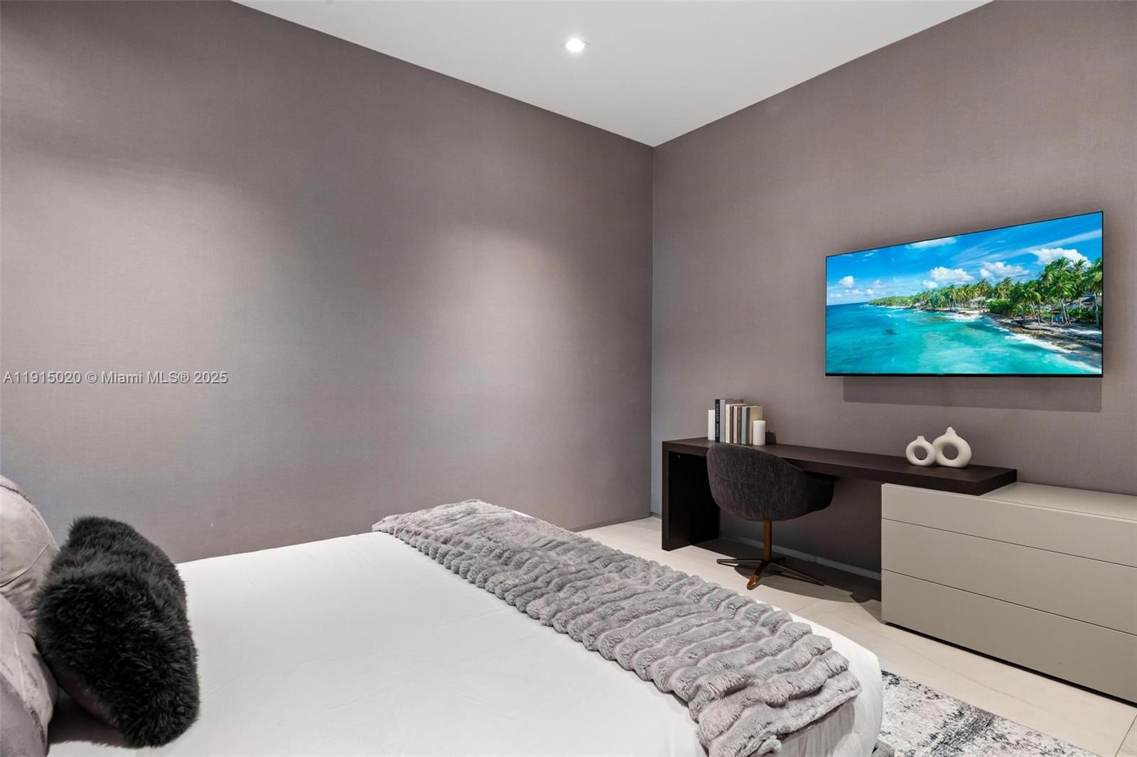 77 Southwest 18th Terrace Miami, FL 33129 - Photo 68 of 90 a bedroom with a bed and a flat screen tv