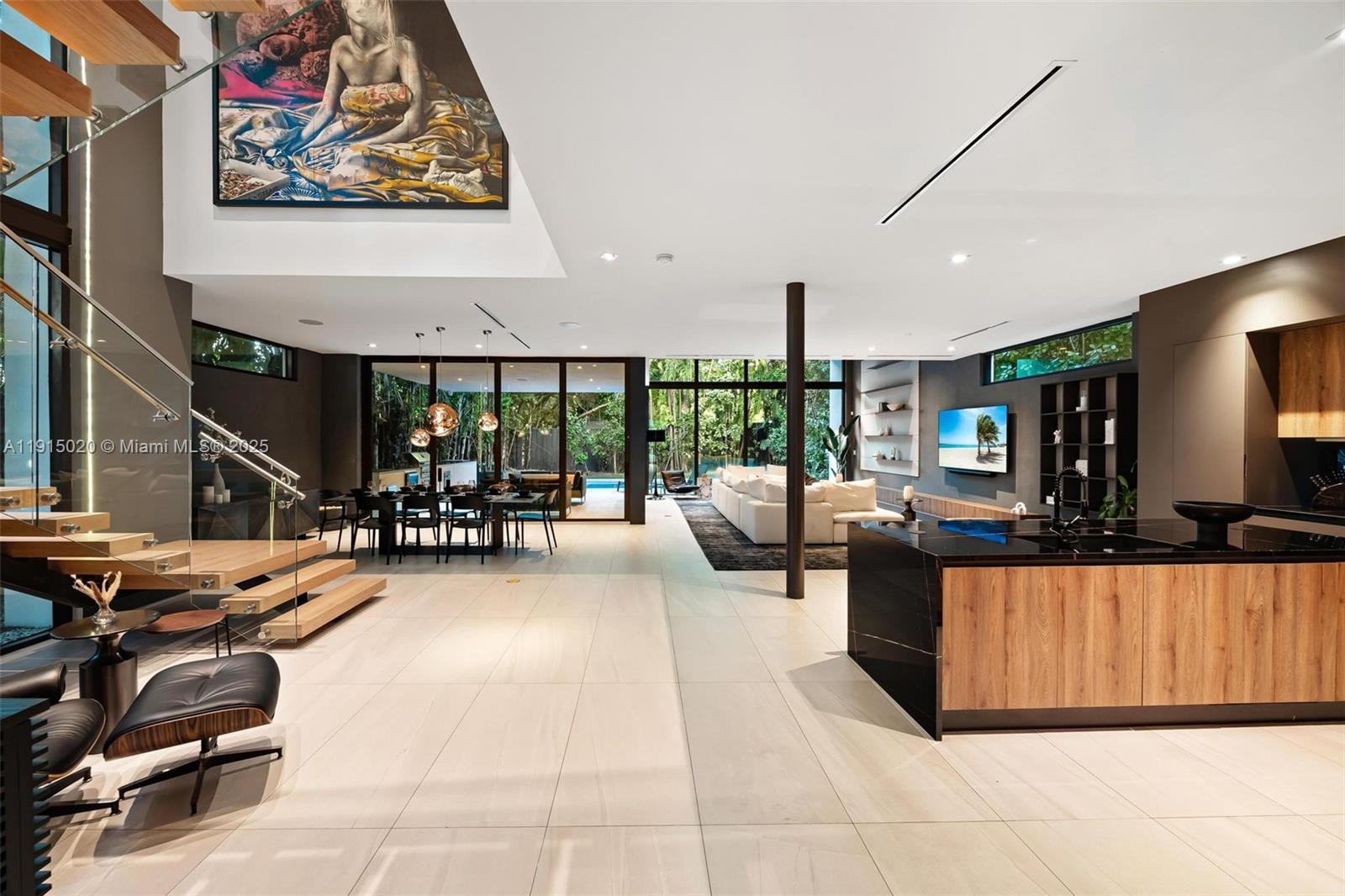 77 Southwest 18th Terrace Miami, FL 33129 - Photo 7 of 90 a living room with furniture a wooden floor and next to a window