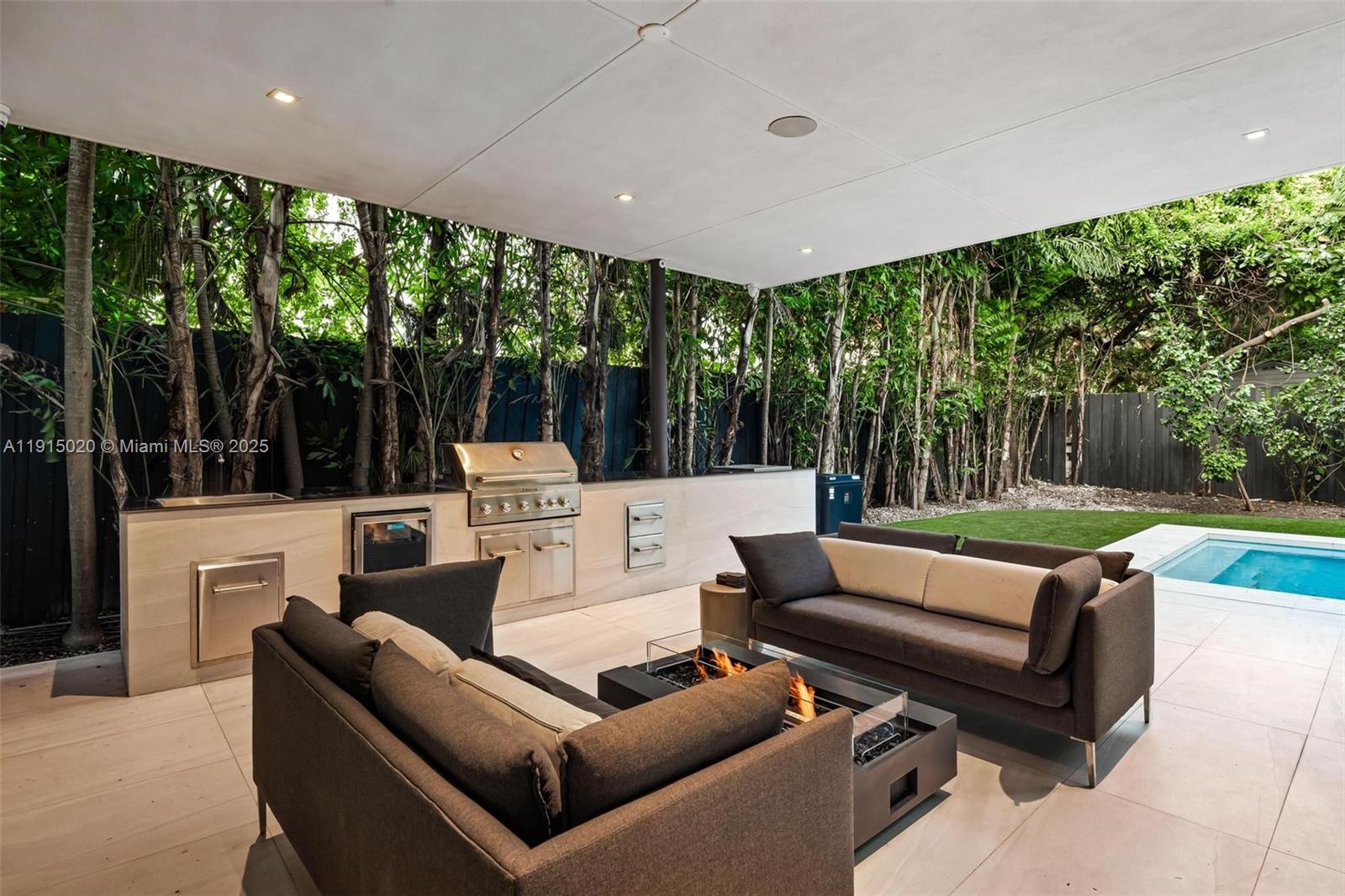 77 Southwest 18th Terrace Miami, FL 33129 - Photo 73 of 90 a outdoor living space with furniture and garden view