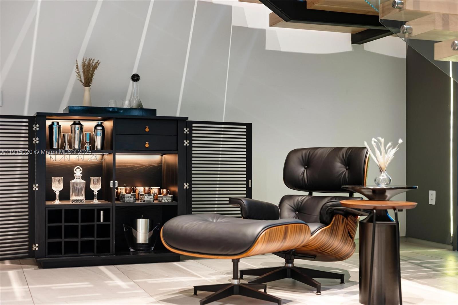 77 Southwest 18th Terrace Miami, FL 33129 - Photo 8 of 90 a room with gym equipment and a flat screen tv