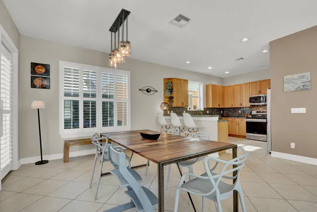 a dining room with furniture and window