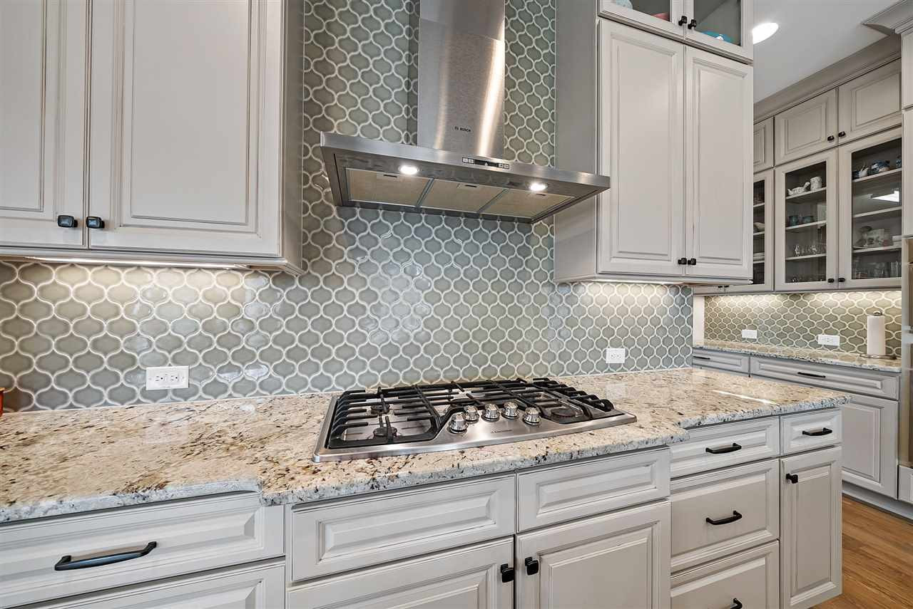 5208 Woodall Way Raleigh, NC 27613 - Photo 5 of 30 Sellers replaced the tile backsplash after closing.