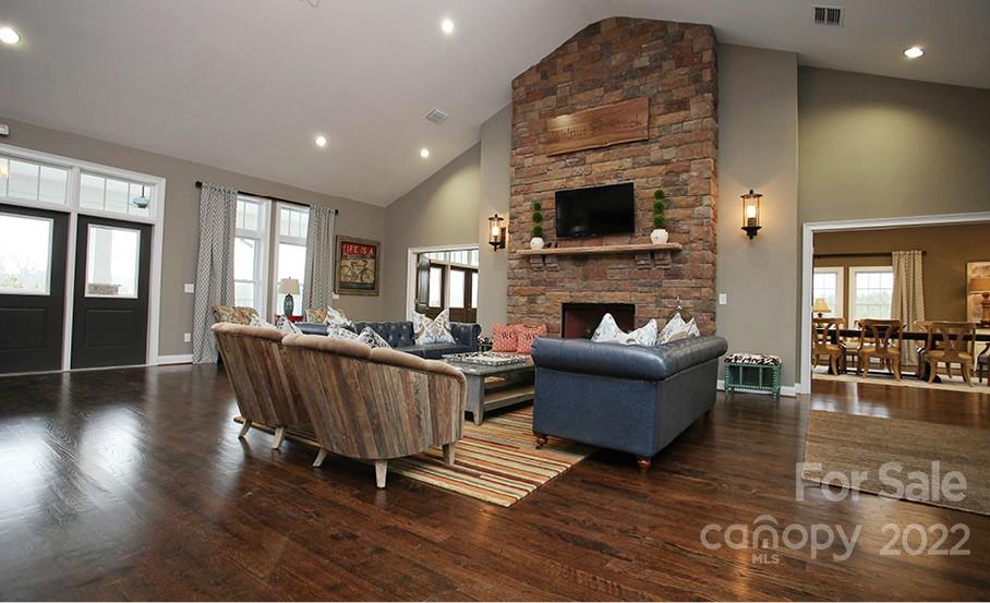 5763 Soft Shell Drive, Unit 313 Lancaster, SC 29720 - Photo 17 of 26 a living room with furniture and a fireplace